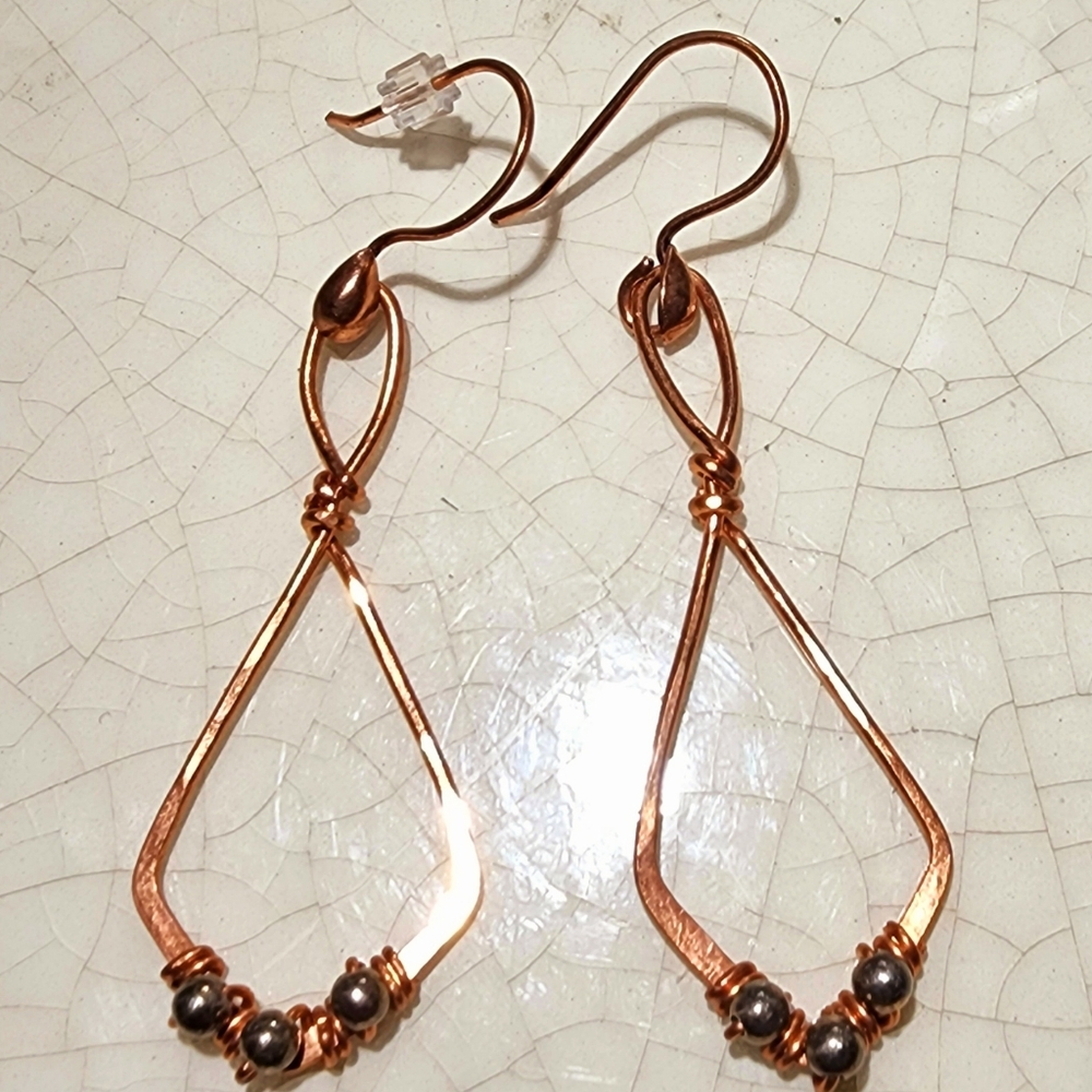 Copper Knot with 3 hematite stationary beads dangle earrings.